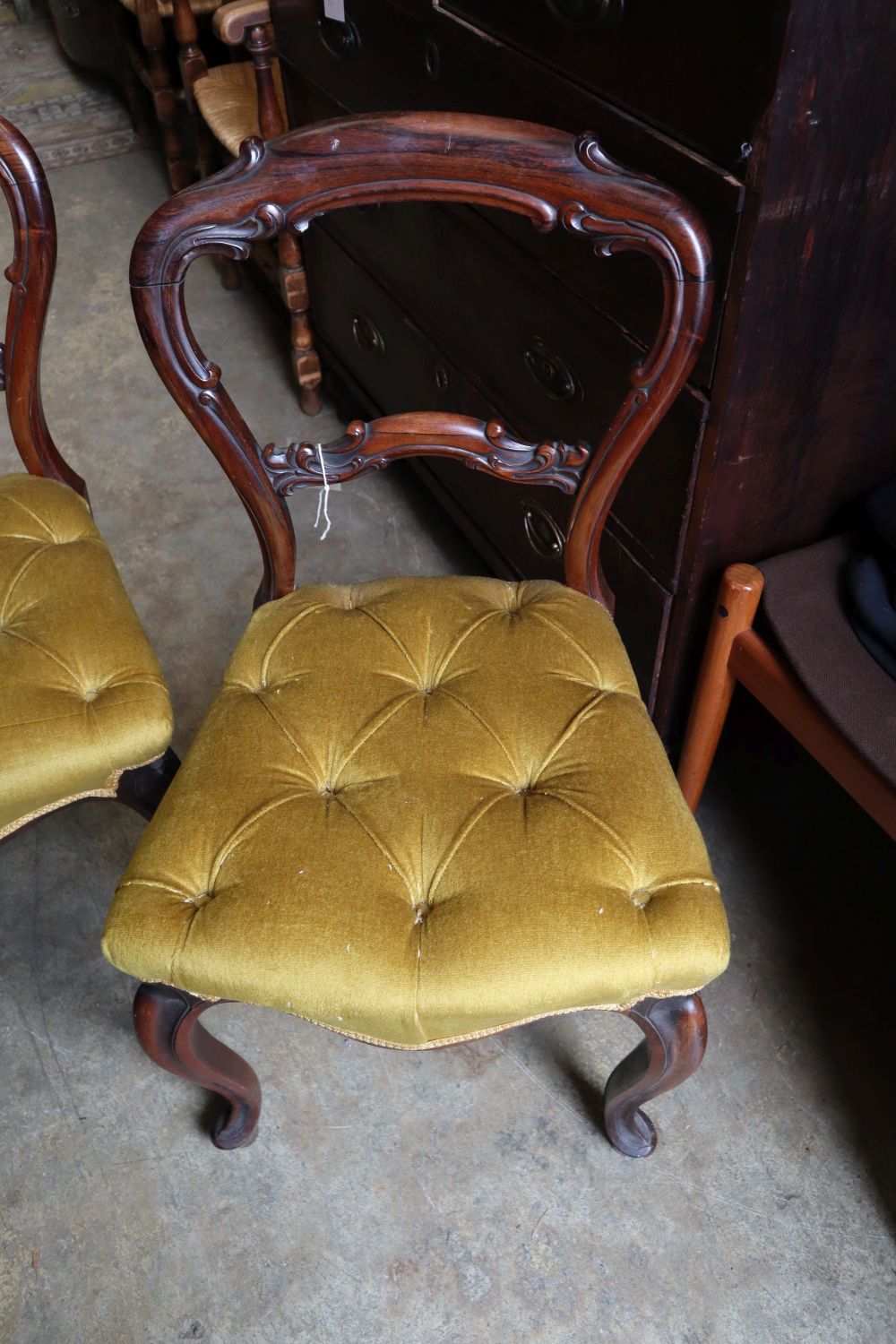 A set of six mid Victorian rosewood balloon back dining chairs with buttoned gold dralon seats